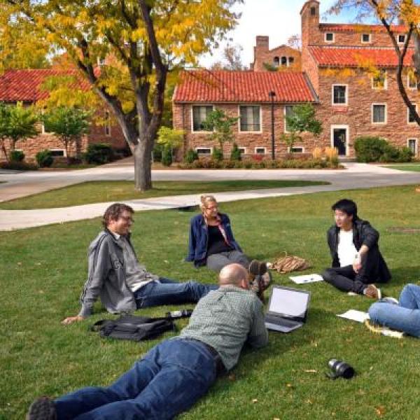 student sitting in circle outside