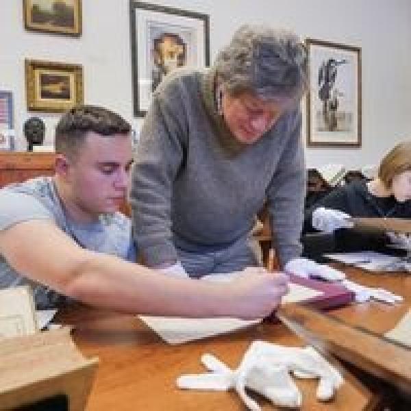 Photo of student and instructor in classroom