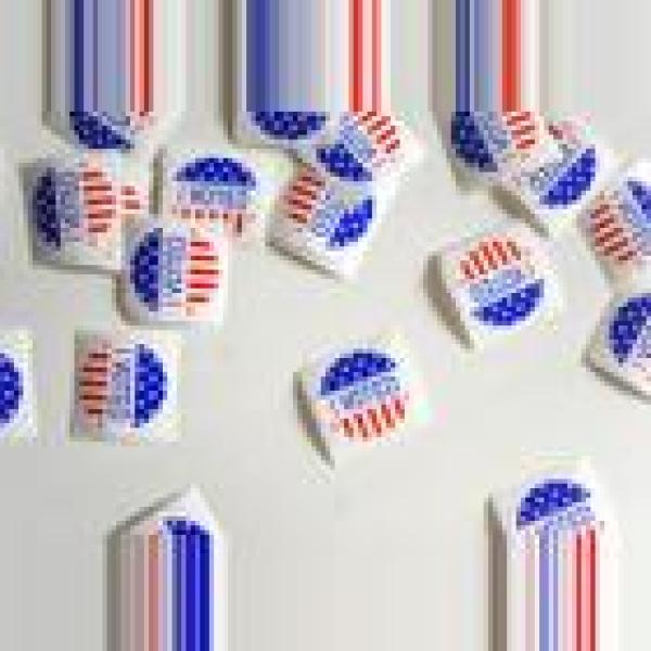 Photo of I Voted stickers on a tab;e