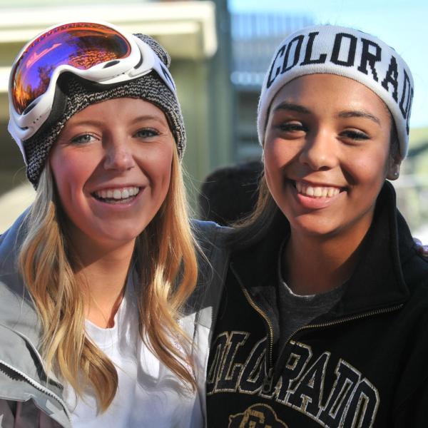 Two girls about to go skiing