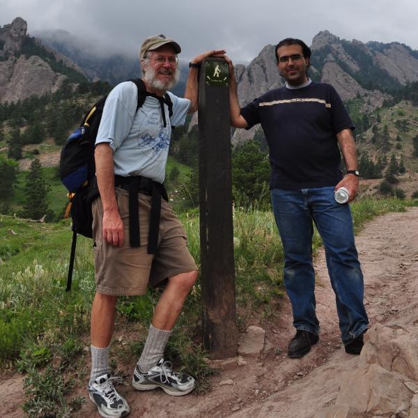 BFIS family member and student posing at base of Chautauqua