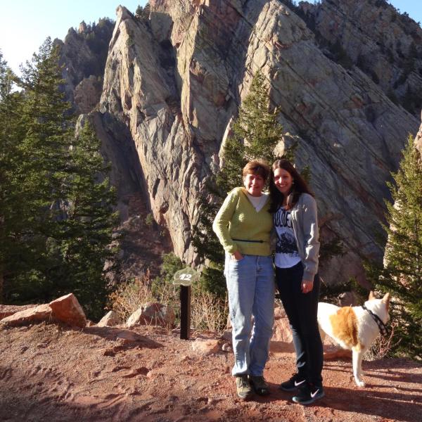 BFIS family member and student in front of flatirons