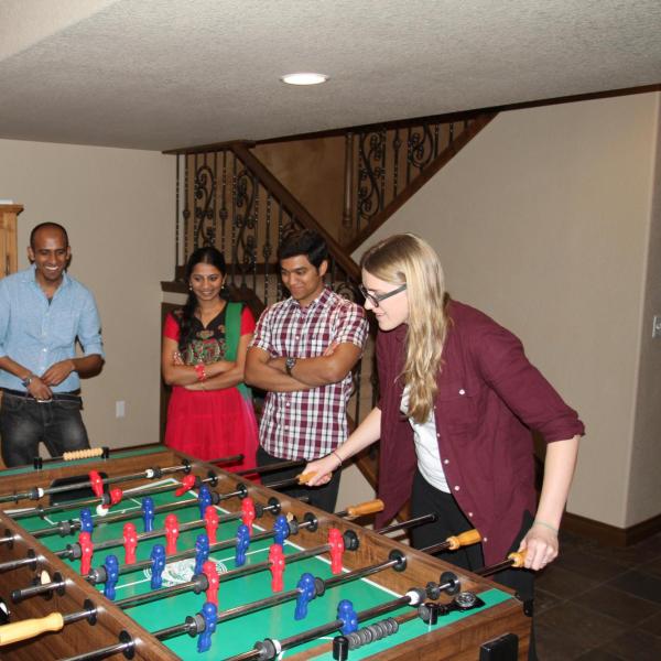 Several BFIS members playing foosball