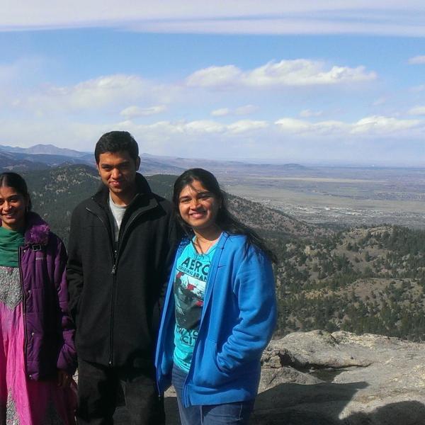 BFIS family member and three students at hiking overlook