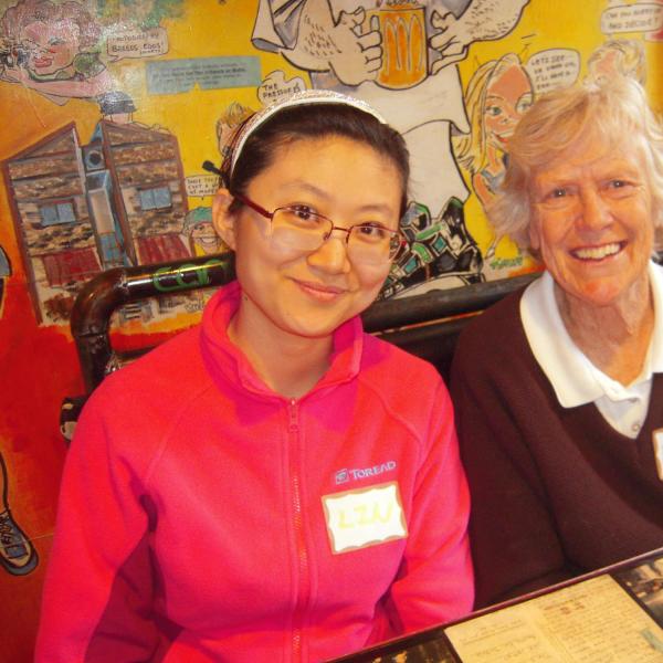 BFIS student and family member sitting at restaurant booth