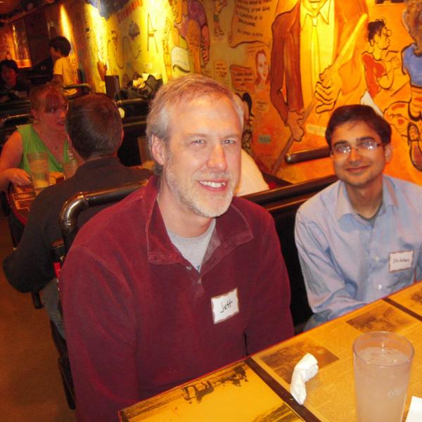 BFIS family member and student sitting at restaurant booth