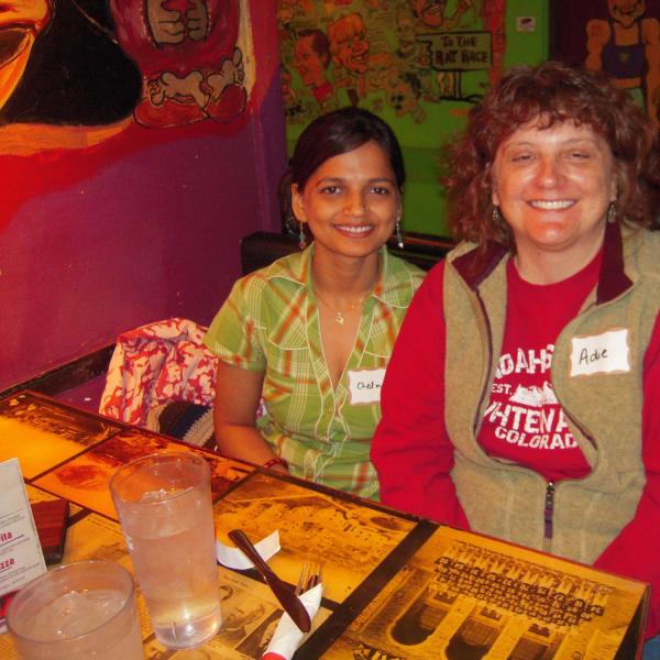 BFIS family member and student sitting at restaurant booth