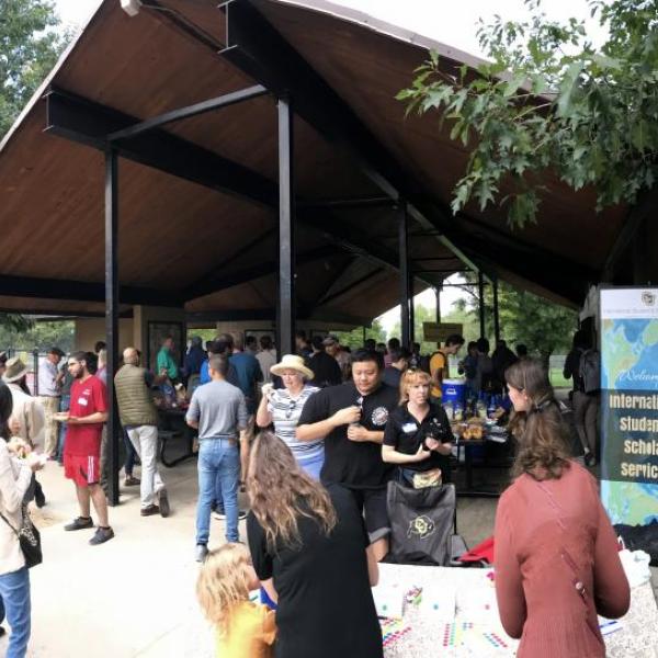 View of picnic shelter and picnic attendees from the outside