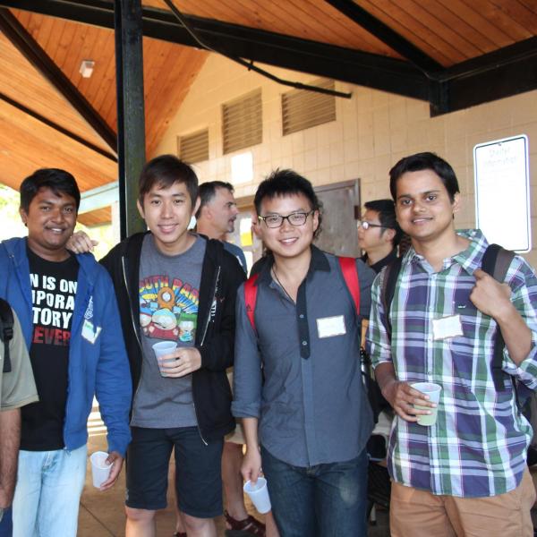 Six BFIS students smiling under picnic shelter