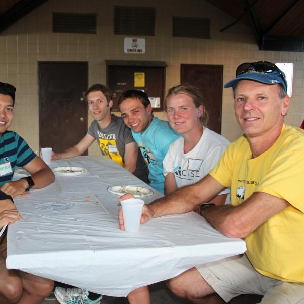 Six BFIS members sitting at picnic table