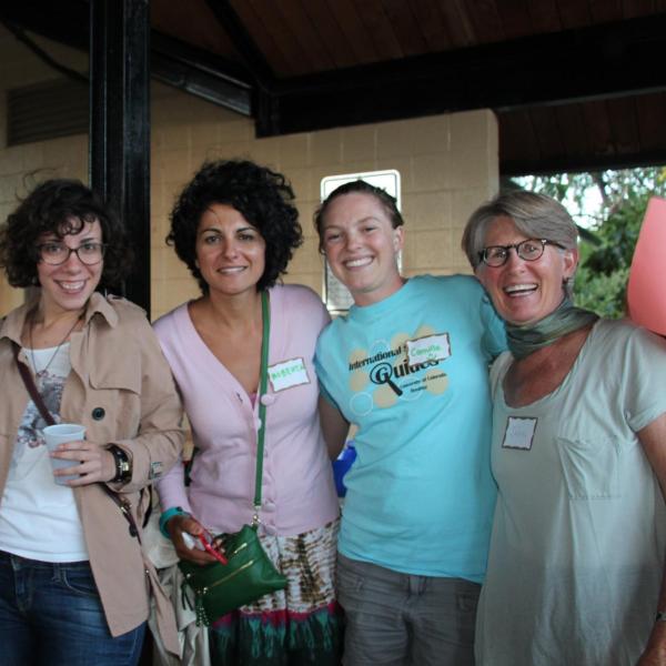 Five BFIS members smiling under picnic shelter