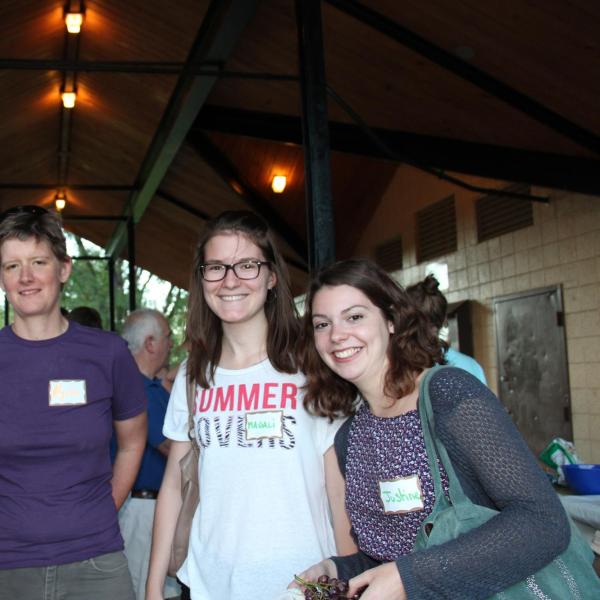 Four BFIS members standing under picnic shelter