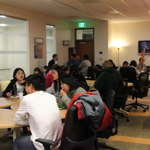 Many BFIS members sitting at tables inside