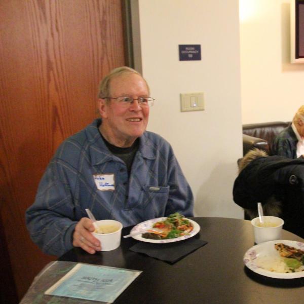 BFIS member and student at table with food