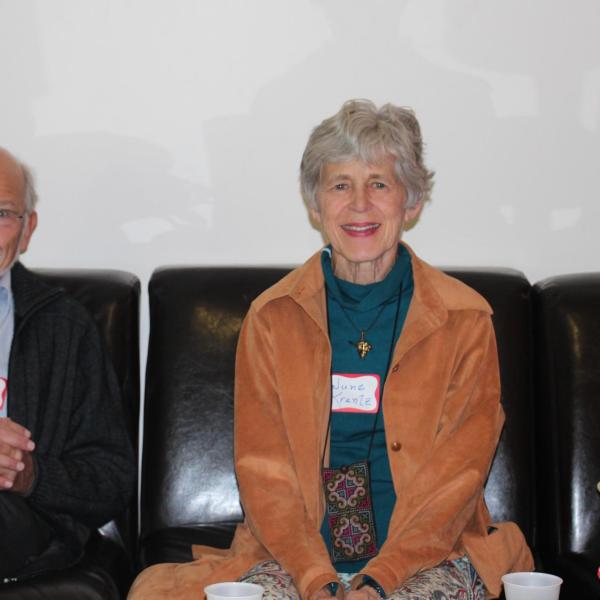 Two BFIS family members sitting on couch
