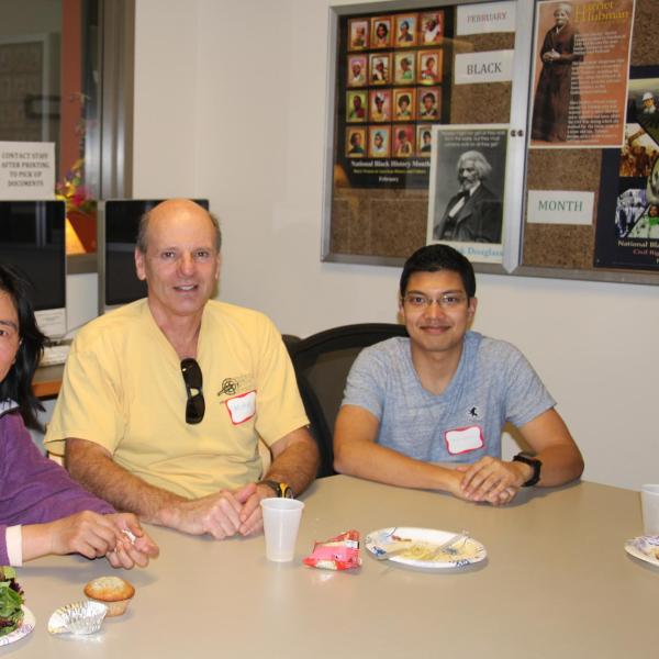 BFIS family and student sitting at table