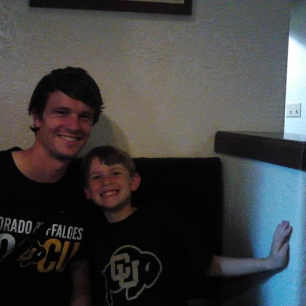 BFIS student with younger host brother in CU gear