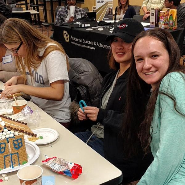 Students smiling with their house