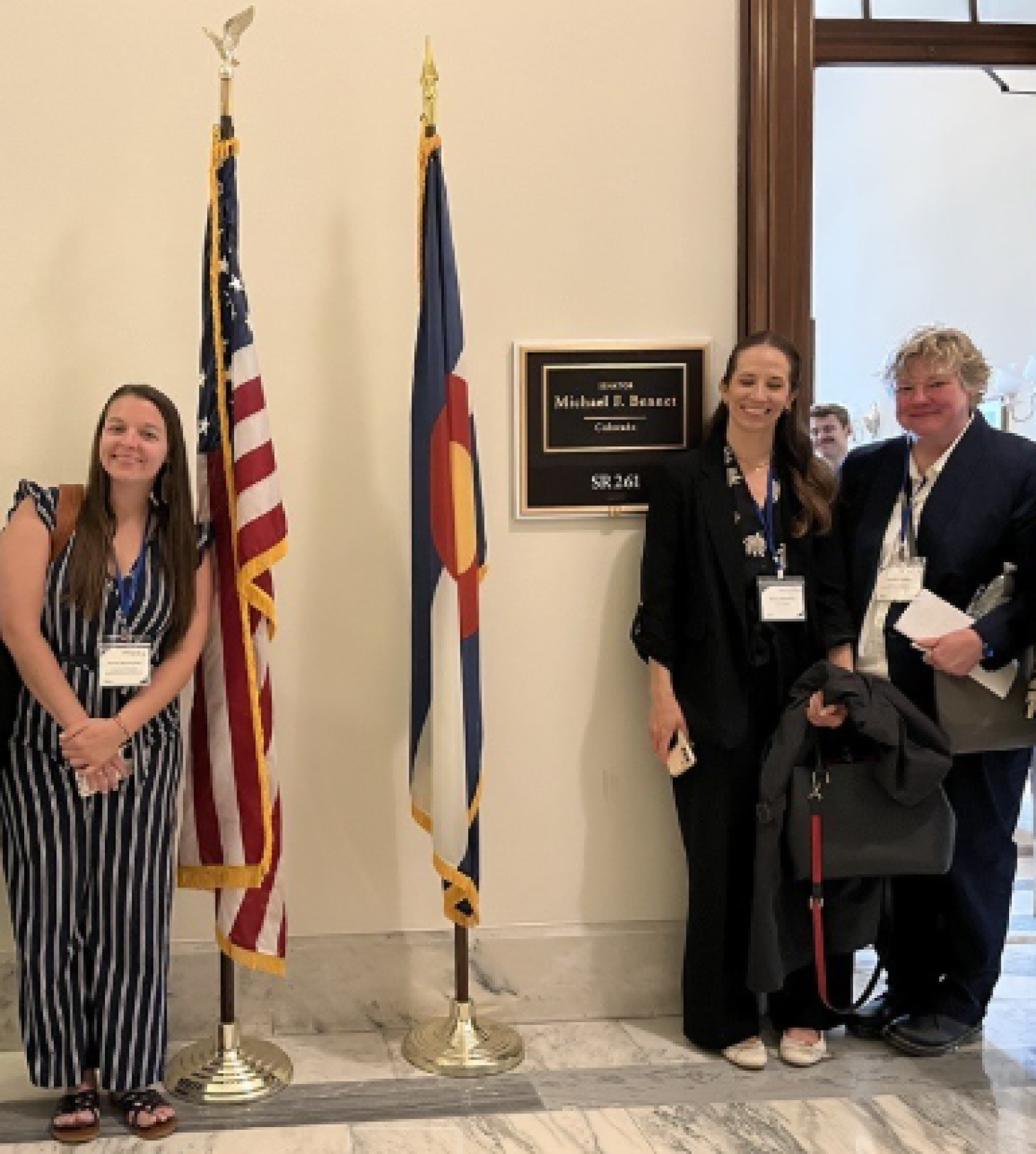 ISSS Staff Chris Hertel and Amrine Obermueller posing outside Senator Michael Bennets Office Door