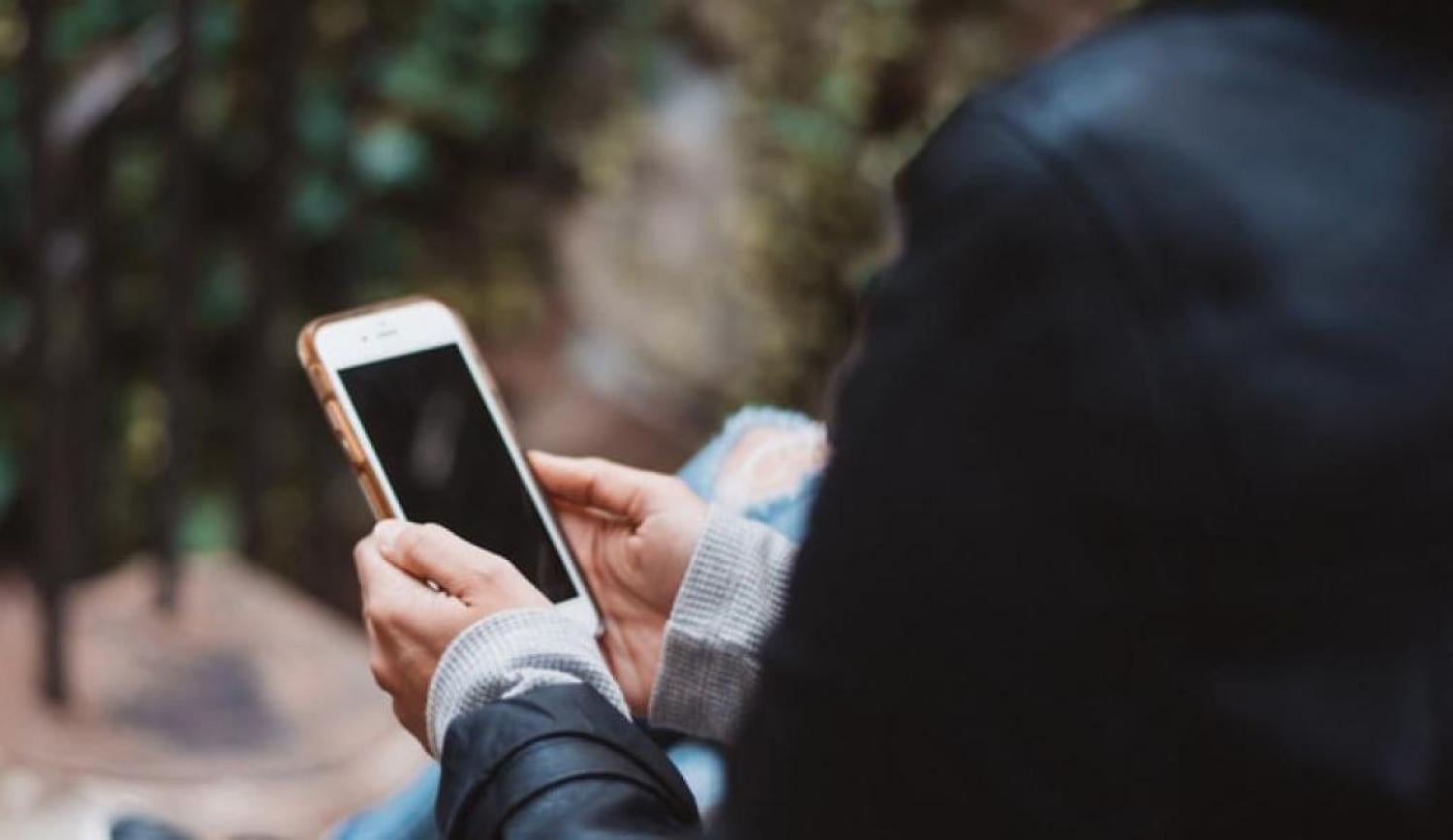 A man looking at his phone