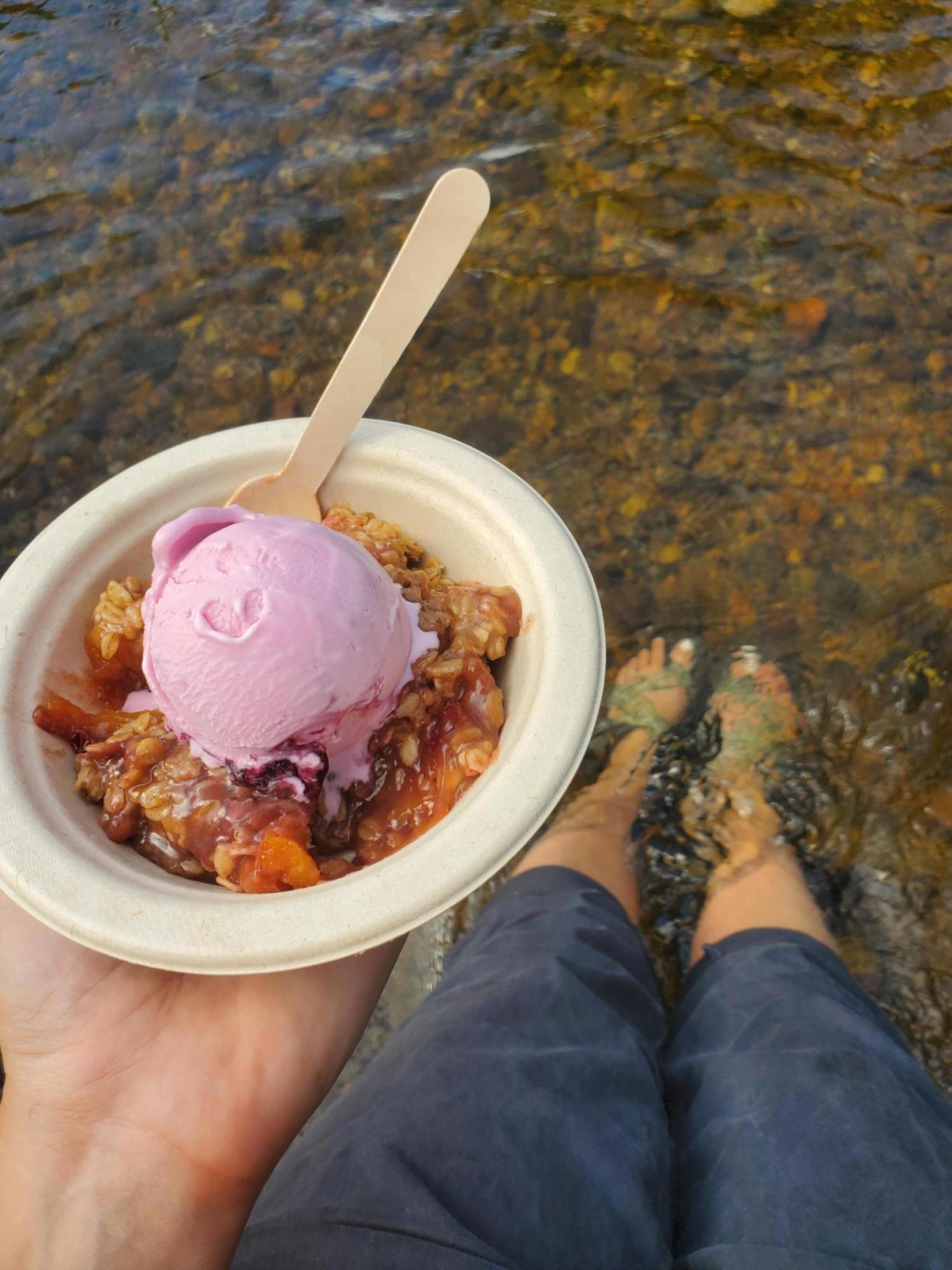 Picture of peach crumble with ice cream on top