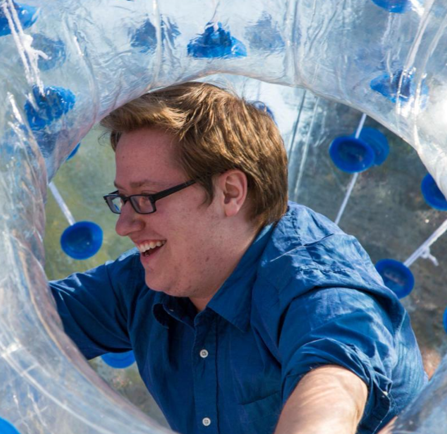 guy having fun in an inflatable bubble