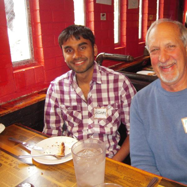 Two BFIS members sitting at restaurant booth