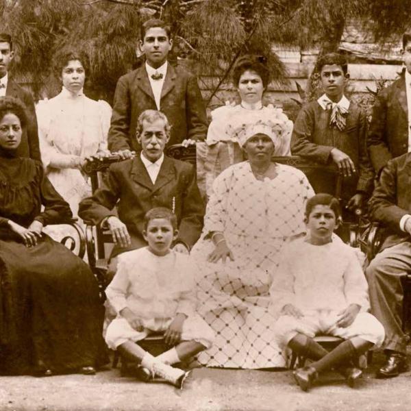 Fernandes family, Suriname ca. 1908. At center are Isaac Daniel Fernandes, a Portuguese Jew from a planter family, and Klasina Elisabeth Vroom, descended from a family of manumitted slaves. Surrounding them are their eight children and a daughter-in-law. Courtesy of the Fernandes-Vroom family.