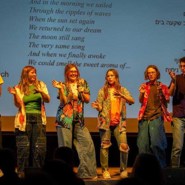 Students singing on stage