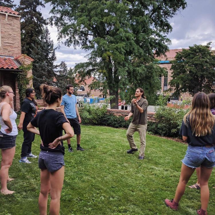 Internship students learning outside during their weekly class