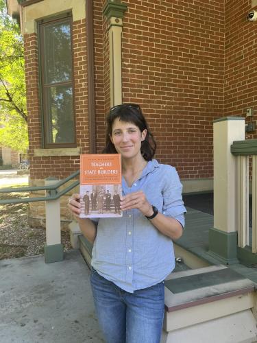 Kalisman holding a copy of her book