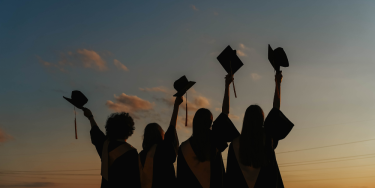 Silhouettes of graduating students