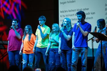 CU Boulder Hebrew students singing on stage