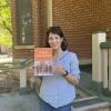 Kalisman holding copy of her book