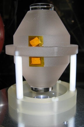 This vertically mounted high finesse optical cavity signifacantly increases the stability of a laser system using a fiber laser.