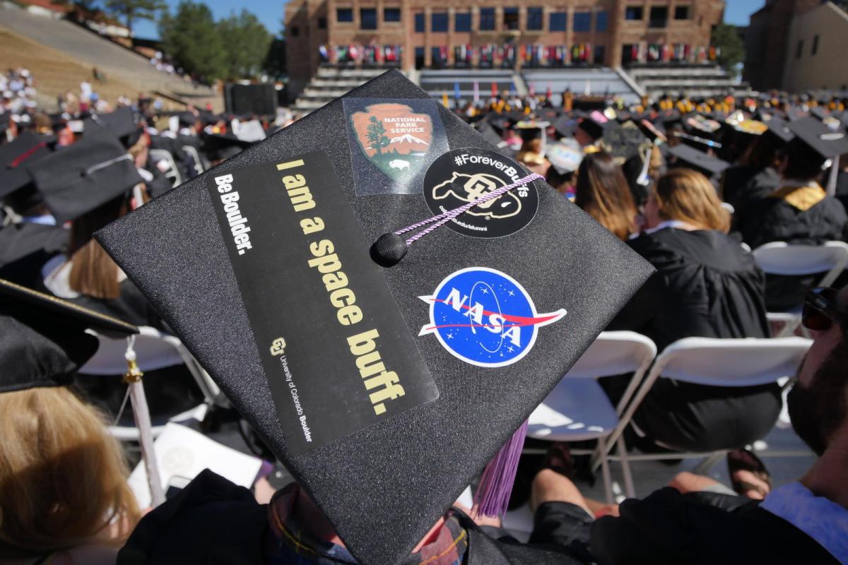 CU student at graduation in their cap.