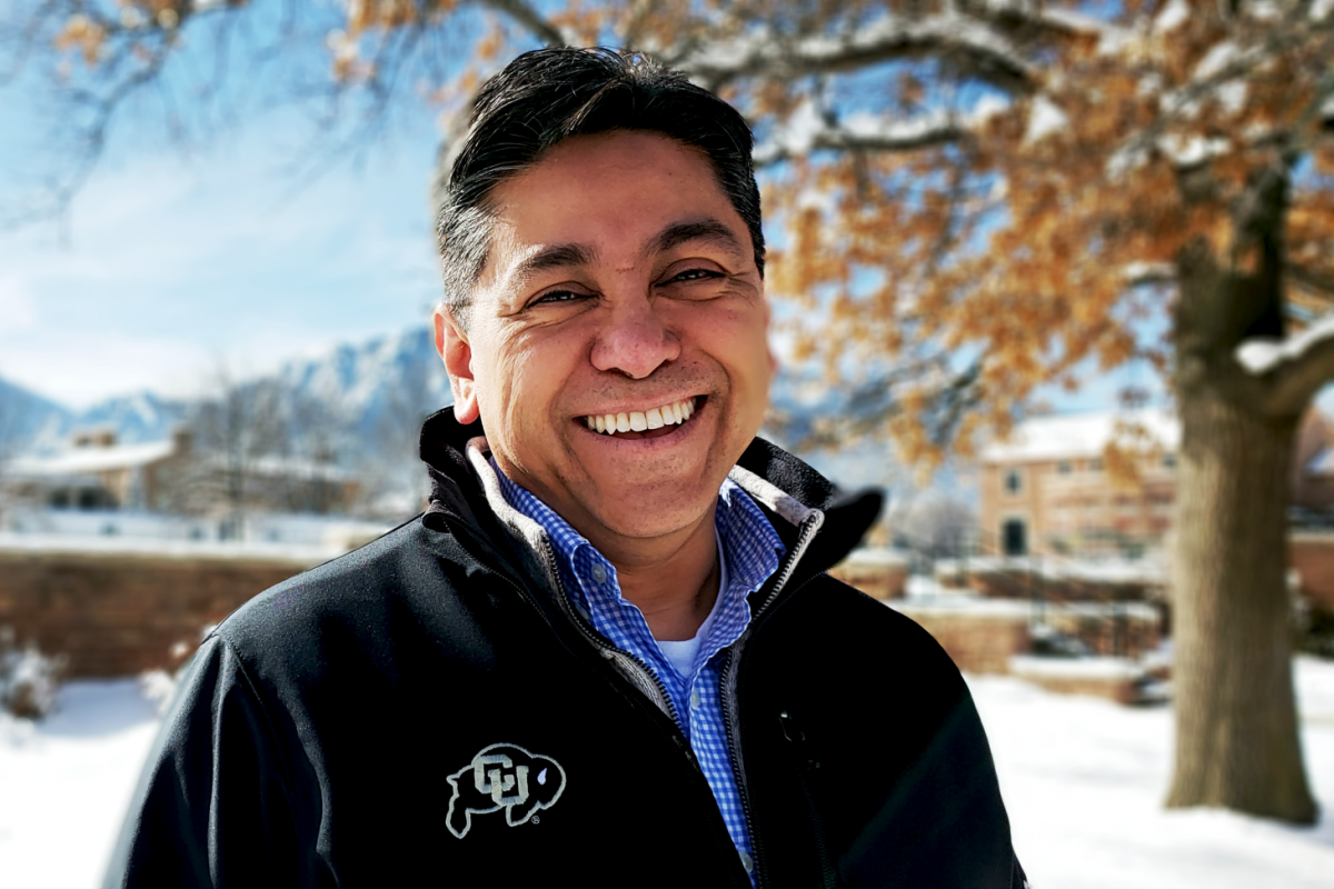 Employee smiling at Farrand Field.