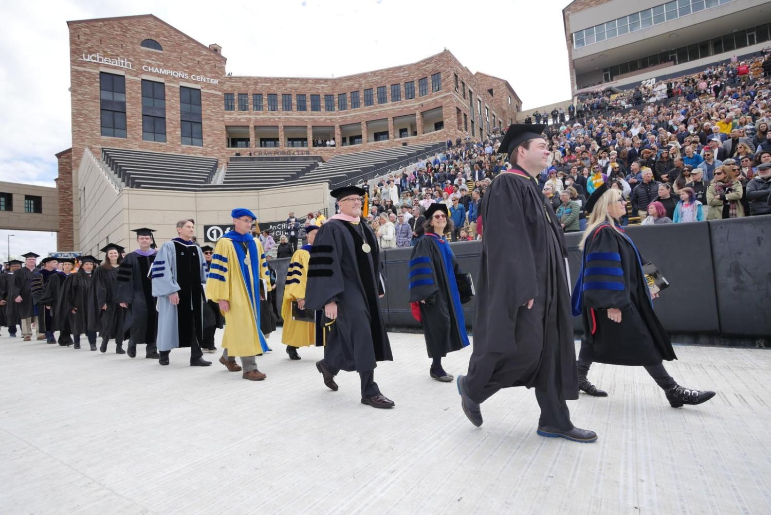 Faculty processing at an outdoor Commencement ceremony at the University of Colorado Boulder. (Photo by Casey A. Cass/University of Colorado)