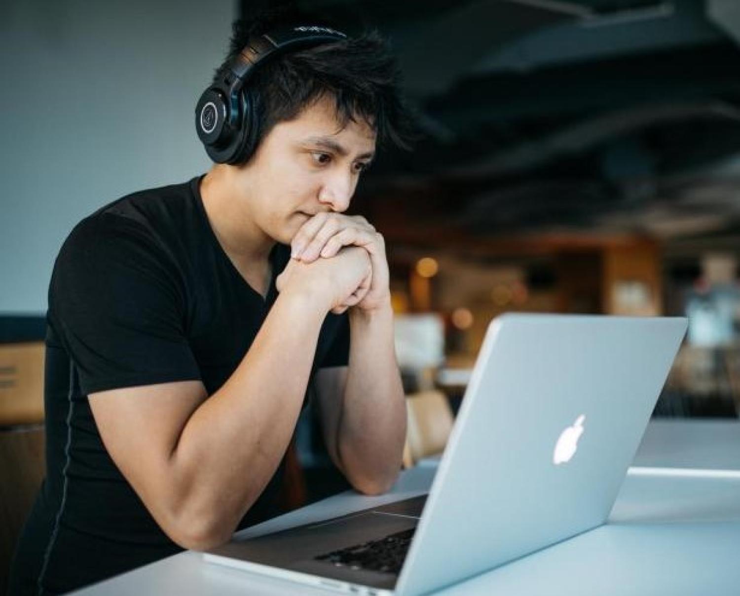 Person Writing on Computer