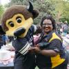 CU Boulder Staff Member Smiling with Chip the Mascot