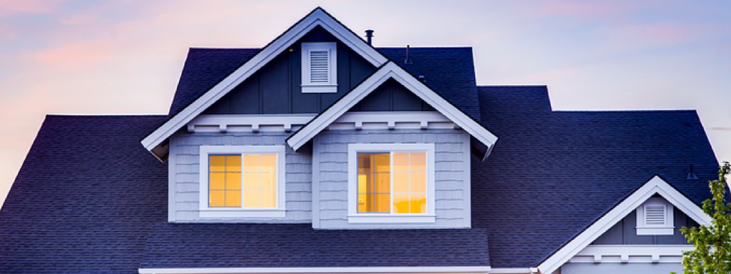 Picture of house with lights on inside