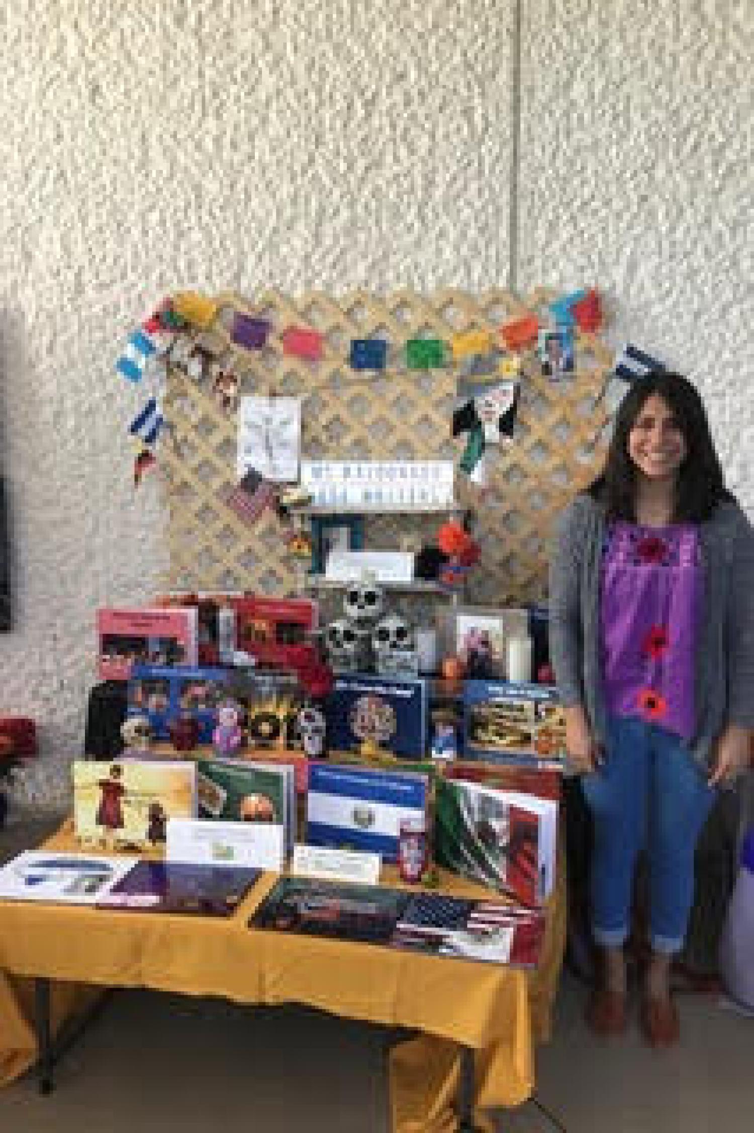 Alethea with Día de los Muertos altar