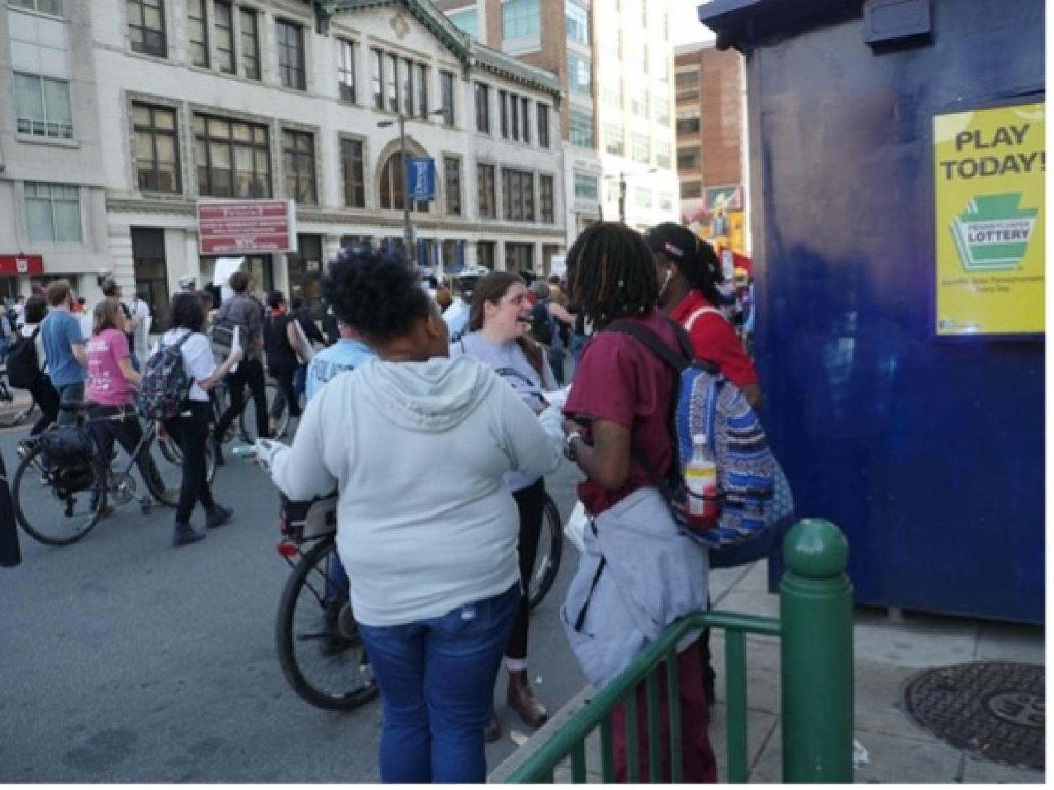 Stadium stomper canvassing community members during a protest march