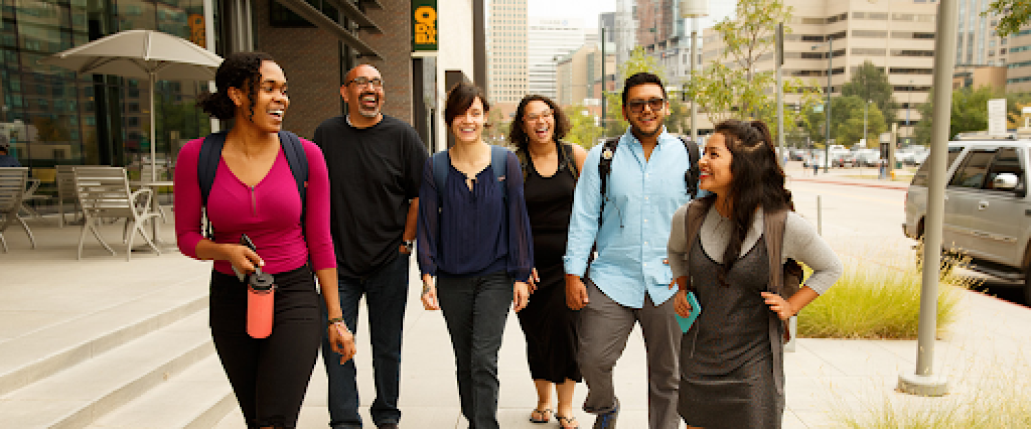 Manuel Espinoza walking with his students outside the Students Commons Building