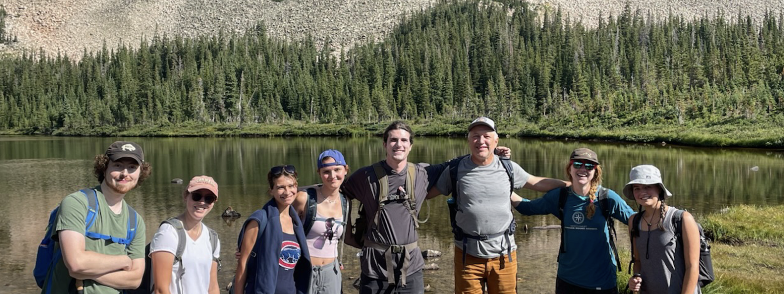 Group in front of a lake
