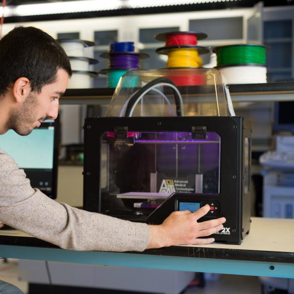 Joan working with the 3D printer.