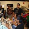CU’s Engineering Success Institute with students practicing their surgical skills using surgical trainers