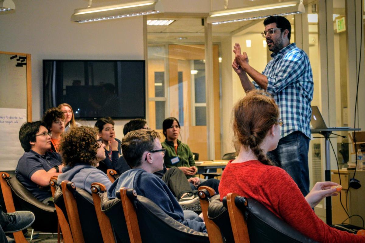 Dr. Ruben talking to a group of students