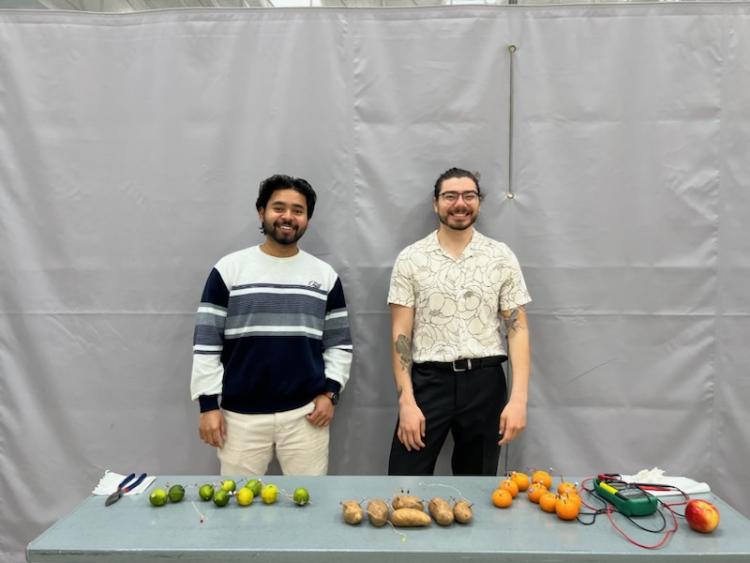 Dakota and Sufiyan helping at EEE fair.