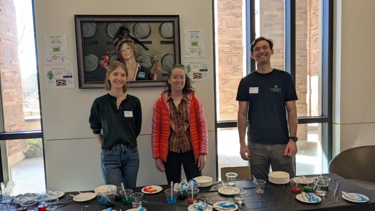 Our three graduate student volunteers before the event all smiling.